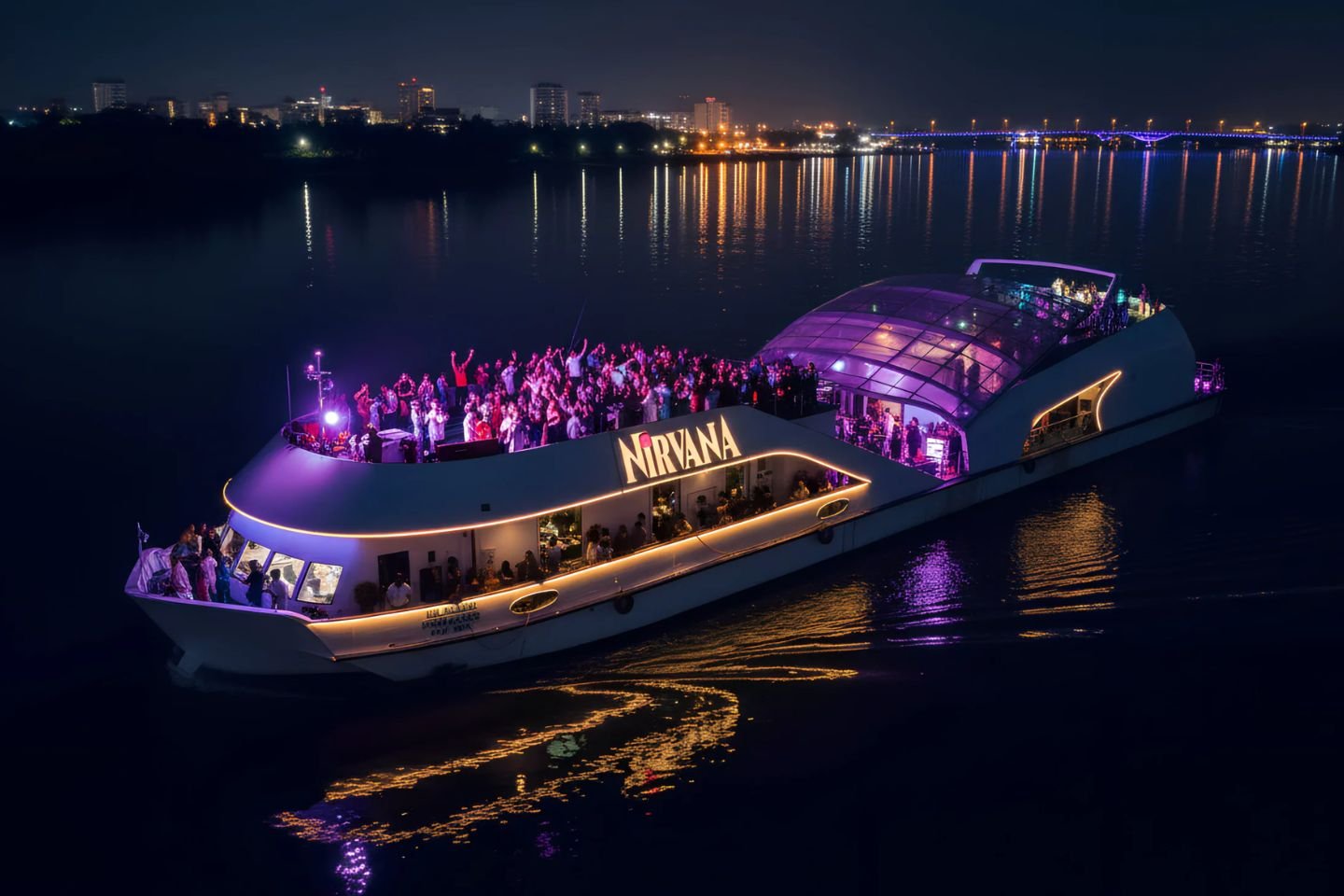 Nirvana luxury cruise party boat glowing at night on Goa's Mandovi River